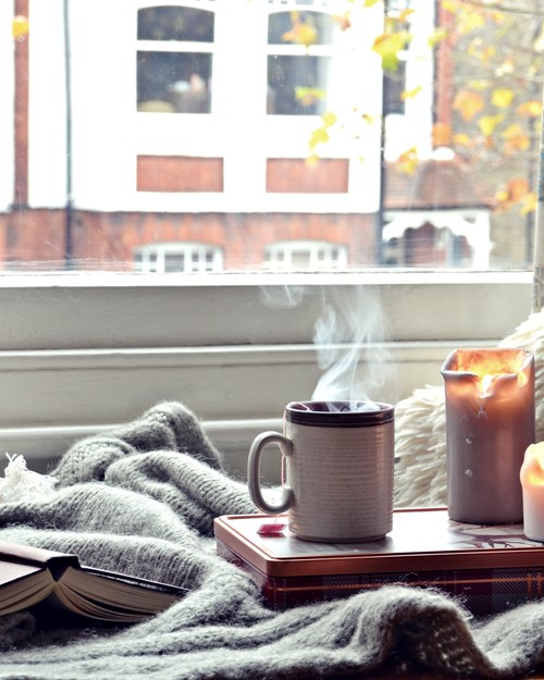 Cosy home with candles and coffee