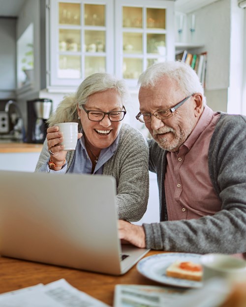 Retired couple researching mortgages