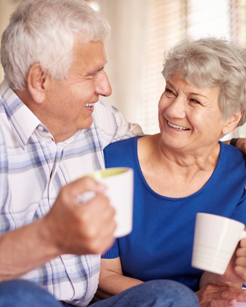 Old couple with cup of coffee